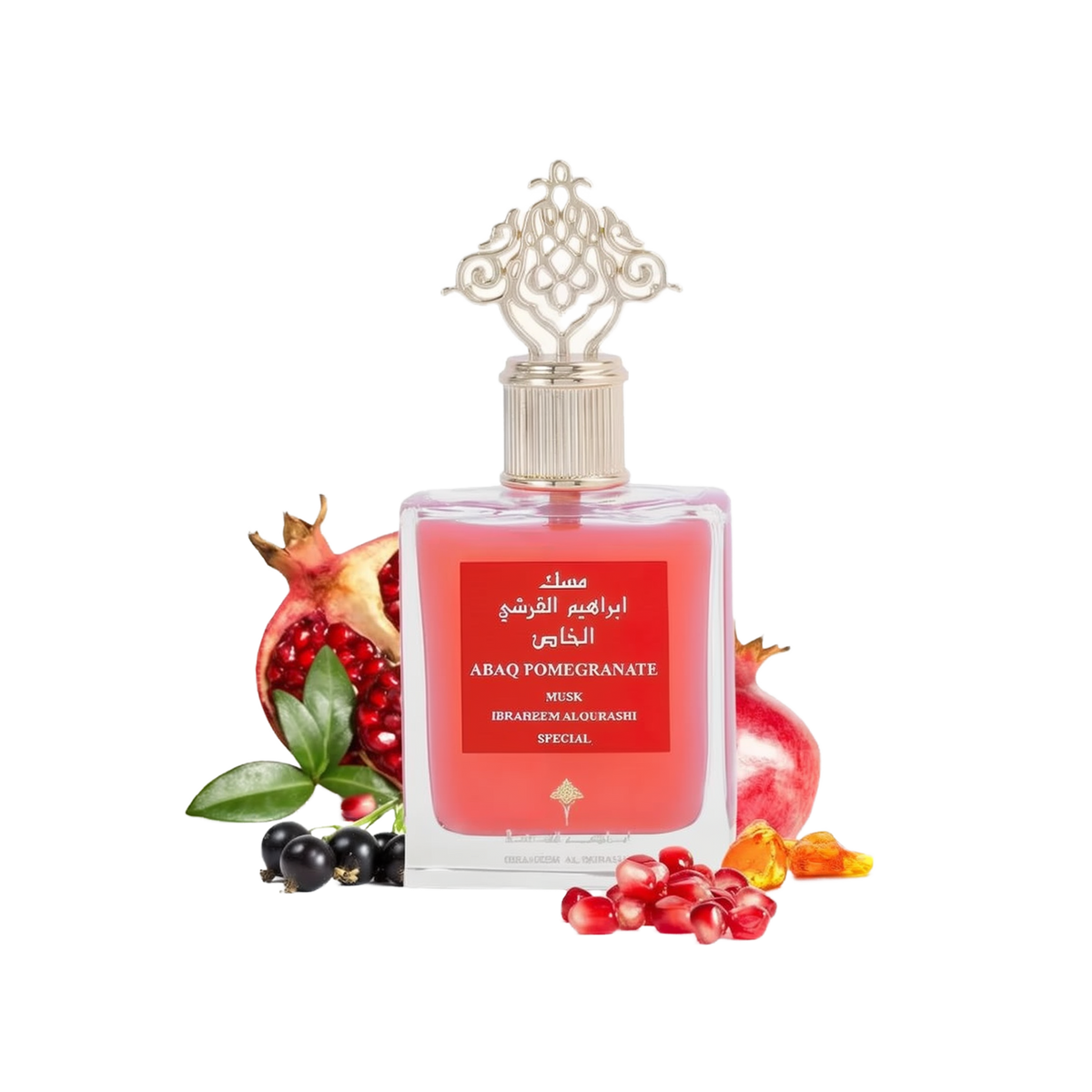 The image shows a product, which is a bottle of perfume named "ABAQ POMEGRANATE MUSK" by Ibraheem Al Qurashi. The perfume bottle has a clear, ornate design with a gold-colored cap featuring intricate patterns. The liquid inside the bottle is a rich red color, and the label is red with white and gold text. Surrounding the bottle are several pomegranates and loose pomegranate seeds, as well as a few black currants, which are likely meant to suggest the fragrance notes of the perfume.