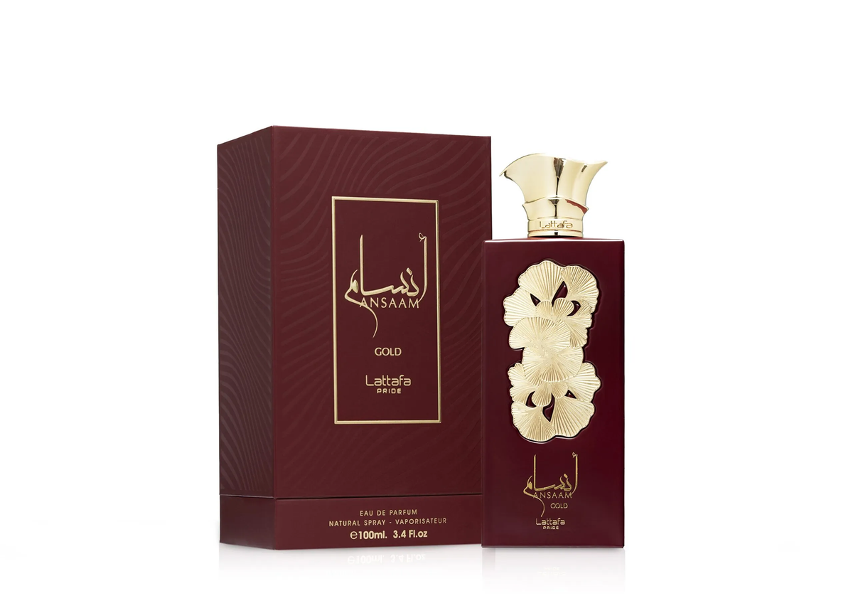 Lattafa Ansaam Gold perfume bottle with floral gold design beside matching maroon box.
