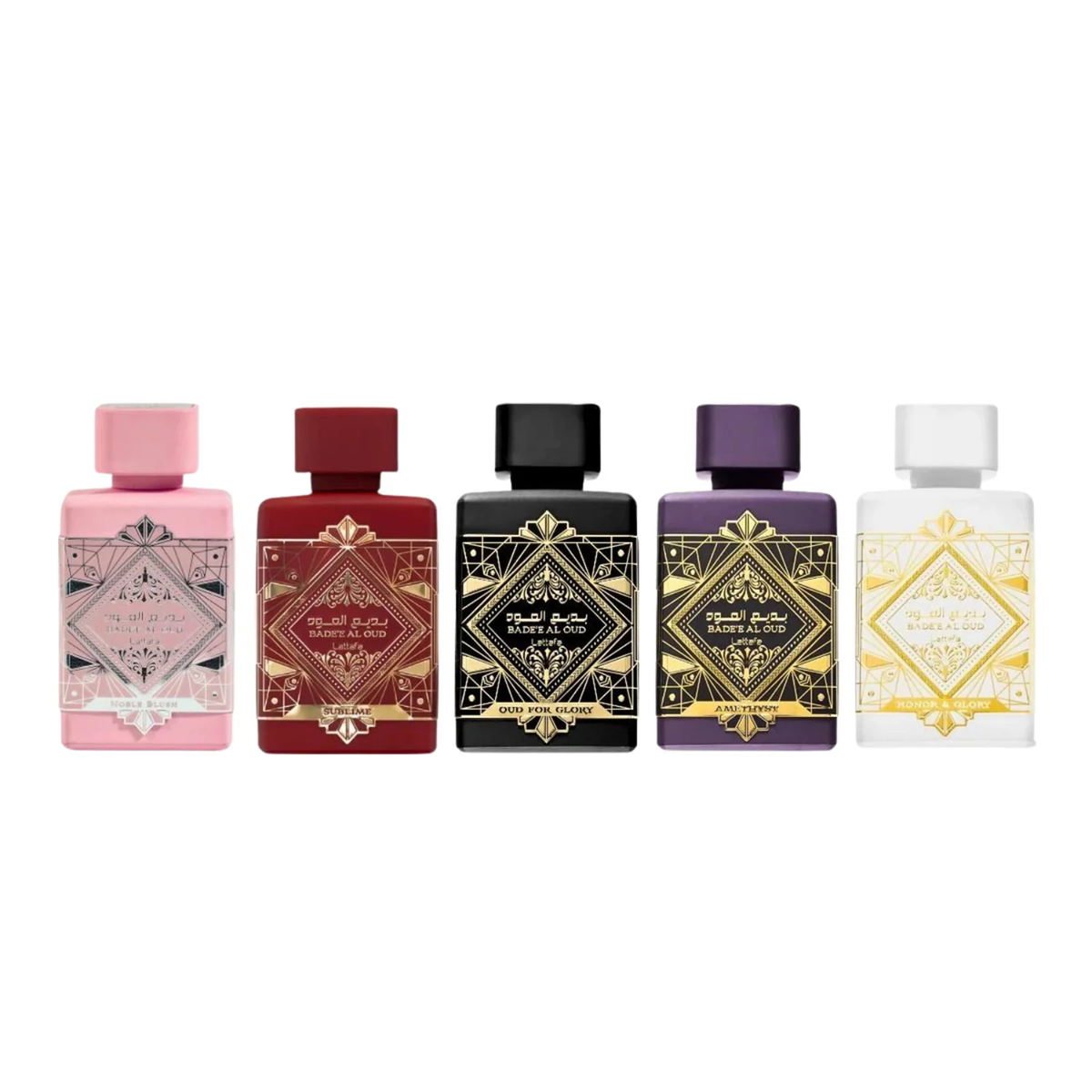A lineup of five Bade’e Al Oud perfume bottles in different colors. Pink, red, black, purple, and white.