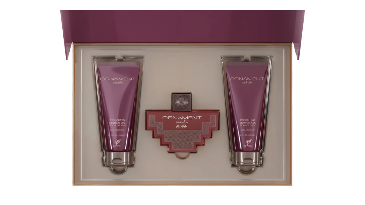The image shows a gift set by Afnan Perfumes, "ORNAMENT purple allure". It features a perfume bottle and two tubes of shower gel, all in a coordinated deep purple color. The bottle has a unique, cross-shaped design with a red body and silver metalwork. The shower gels are labeled "ENERGIZING SHOWER GEL POUR FEMME" and are housed in sleek, metallic purple tubes.