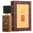 Lattafa Ajwad perfume set featuring the gold bottle with a dark wood cap and the intricate, colorful patterned packaging box.