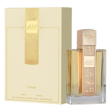 Lattafa Angham, comes in a clear rectangular glass bottle with a gold cap engraved with musical notes and Arabic calligraphy.