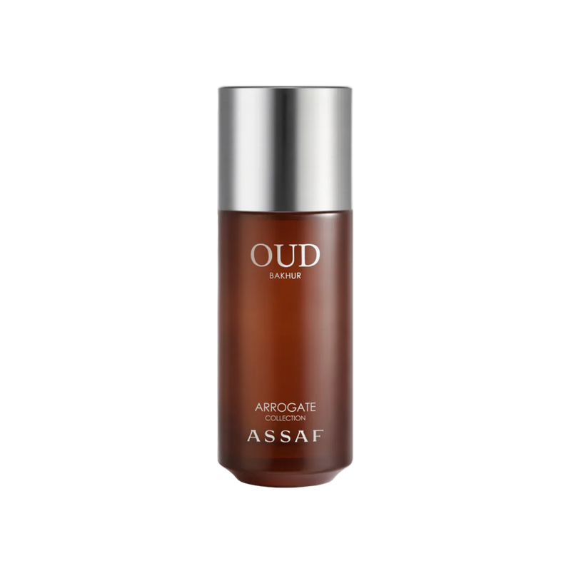 Amber glass perfume bottle labeled Oud Bakhur with silver cap on a clean white background.