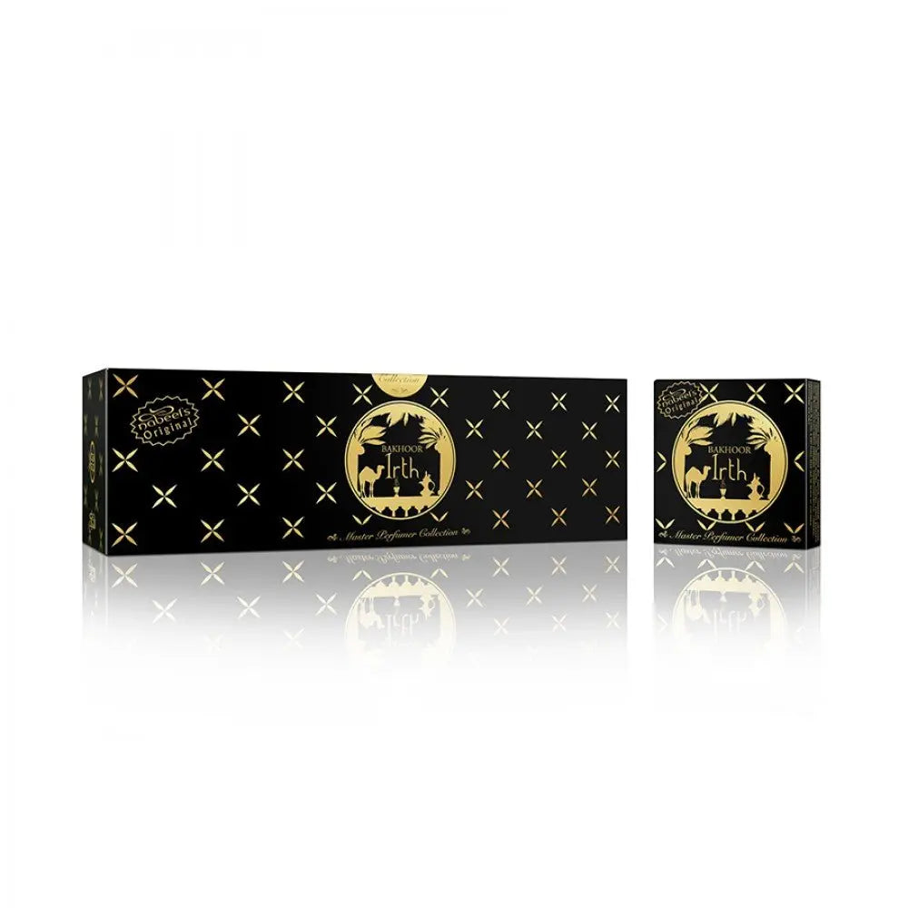 The image shows a sleek, rectangular black box with a glossy finish from the Master Perfumer Collection by Nabeel Perfumes. The box features elegant gold accents in the form of X and plus sign patterns across it. On the front, there's a round gold label with "Bakhoor Irth" inscribed within a circular frame showcasing silhouette imagery of Arabian desert scenes, including palm trees and camels.