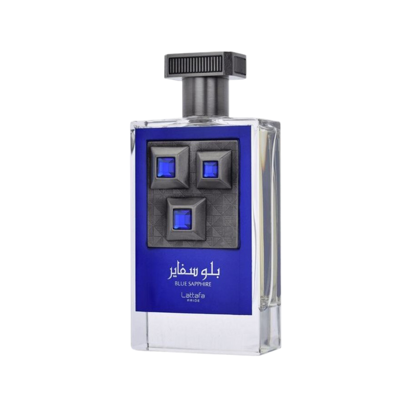 Lattafa Pride Blue Sapphire perfume bottle featuring a dark blue label, clear glass, and a prominent gunmetal plate with three blue square gems.lattafa-pride-blue-sapphire-perfume-bottle.jpg