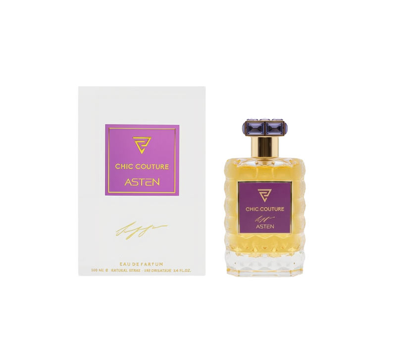 A clear, textured glass perfume bottle filled with a golden-hued fragrance, featuring a square purple label and a faceted purple-and-gold cap, shown alongside a white box displaying a matching purple-and-gold “Chic Couture ASTEN” design.