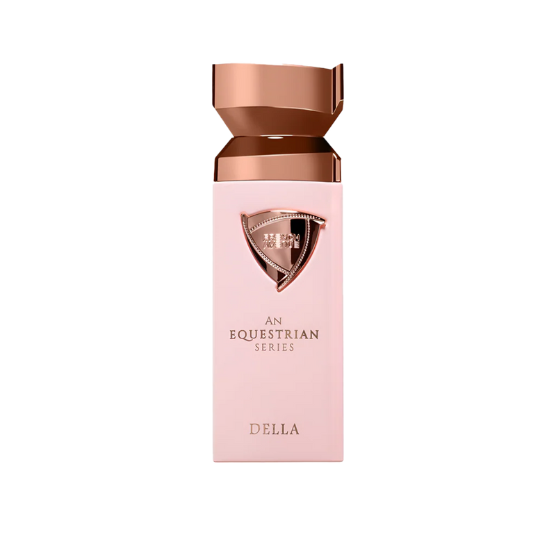 Elegant blush pink Della perfume bottle featuring a rose gold shield emblem and a faceted metallic cap on a white background.della-equestrian-series-blush-pink-rose-gold-perfume-bottle.jpg