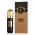A black perfume bottle with a gold cap on the left and its corresponding cardboard packaging on the right. The bottle features a label with "DOMINICAN TOBACCO" in white text, "Extrait de Parfum 100 ml 3.4 fl.oz" in smaller font, and Arabic calligraphy with the brand name "IBRAHEEM AL QURASHI" above. The packaging is brown with a black top, displaying "TOBACCO COLLECTION" in an ornate circular emblem.