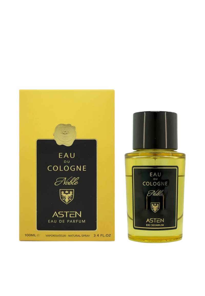 A round glass perfume bottle filled with a golden-hued fragrance and topped by a glossy black cap. It features a black label with gold text reading “Eau Du Cologne Noble” by Asten Eau De Parfum. The bottle is shown beside a matching yellow box with a black panel and gold emblem.