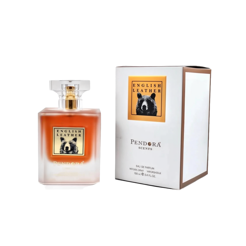A rectangular frosted glass perfume bottle transitioning from clear to warm amber, with a clear square cap and a bear illustration on the label reading “English Leather.” The bottle is shown next to a white box with the same “English Leather” bear label and “Pendora Scents” branding.