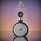 Fakhar Lattafa men's perfume, a dark round bottle with a silver ornate label and cap, standing in water against a gradient background.