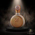 A dramatic shot of the round, white Fakhar Lattafa women's perfume bottle featuring elaborate gold detailing on a black stand.