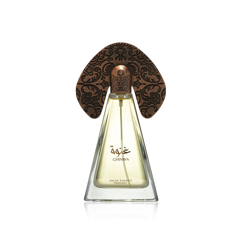 Ghinwa perfume bottle featuring a tapered glass flask and a large, intricately etched copper-toned decorative wing cap.