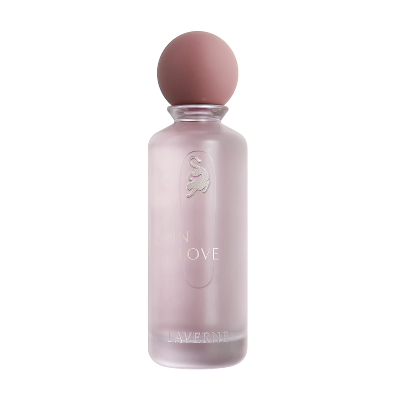 Soft pink frosted In Love perfume bottle by Laverne with rounded cap.
