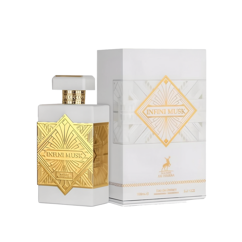 Infini Musk perfume bottle and box by Maison Alhambra. The perfume bottle is rectangular with a white and gold design featuring intricate gold patterns and the text 'Infini Musk' on the front. The matching white box displays a similar gold pattern and tex