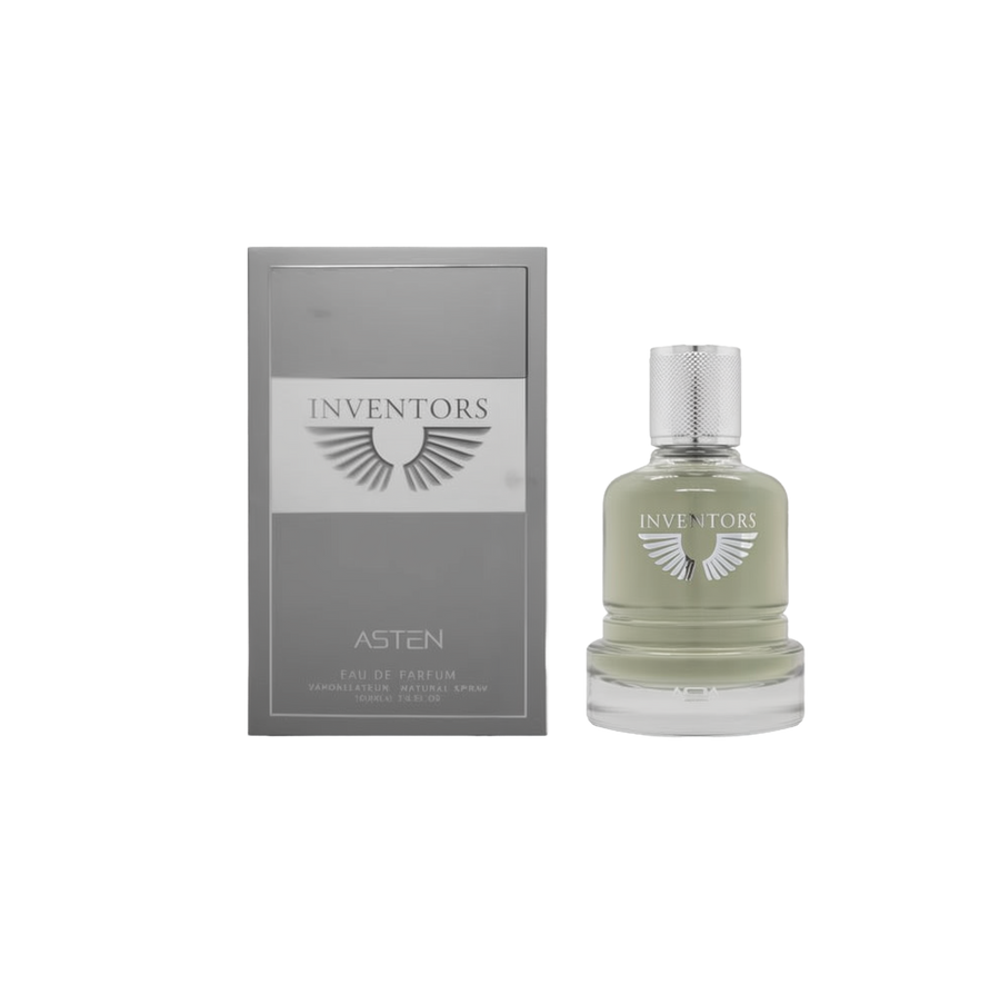 A round glass perfume bottle containing a pale green fragrance, topped with a textured silver cap and labeled ‘Inventors Asten,’ shown beside a grey rectangular box featuring the same winged logo and product name.
