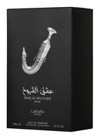 The image shows the packaging for "Ishq Al Shuyukh Silver" Eau de Parfum by Lattafa Pride. It's a black box featuring a highly detailed silver image of a traditional Arabic dagger. The name of the perfume is written in Arabic script above the dagger and i