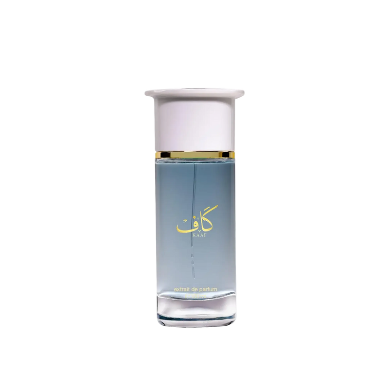Kaaf Extrait De Parfum bottle featuring a tall clear glass design with soft blue liquid, gold Arabic lettering and a white cap with a gold band.