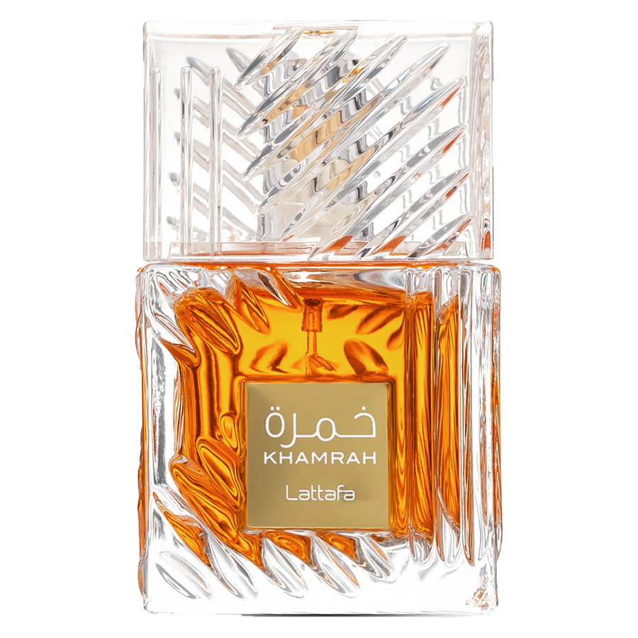 Lattafa Khamrah fragrance in a faceted clear glass bottle filled with rich amber liquid and featuring a gold label.