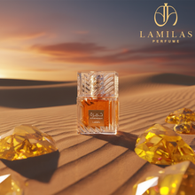Lattafa Khamrah fragrance bottle standing on desert sand, surrounded by yellow gems, under a warm sunset sky.
