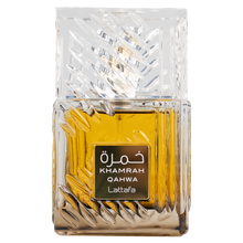 Close-up of Lattafa Khamrah Qahwa perfume bottle with clear glass and golden fragrance.