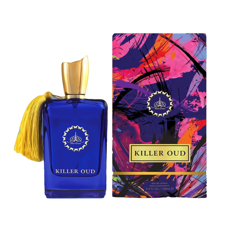 A rectangular cobalt blue perfume bottle with a gold cap and tassel stands beside a tall, vibrantly colored box featuring abstract pink, purple, and black brushstrokes. A circular gold emblem appears on the bottle’s front, and a gold label on the box reads “Killer Oud".