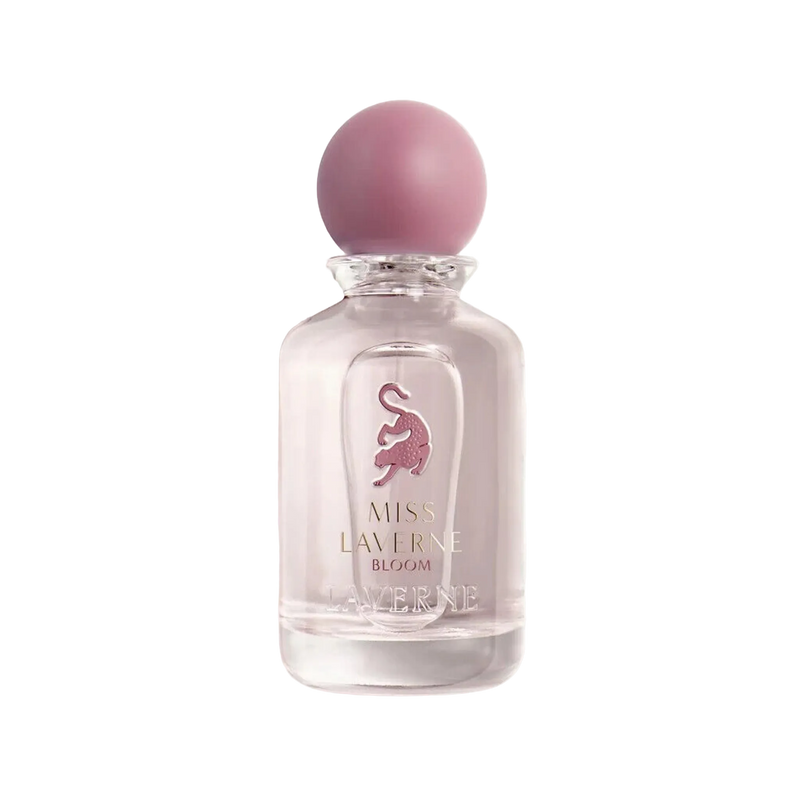 Miss Laverne Bloom perfume bottle in clear glass with a soft pink round cap.