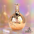 Arabiyat Nyla gold perfume bottle featuring intricate floral embossing, set against a shimmering pastel holographic background.