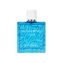 Blue square bottle of Ocean Rush Pour Homme with white cap and wave pattern design.