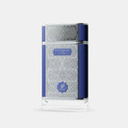 The image displays a perfume bottle with a contemporary design. It has a clear glass body decorated with a white geometric pattern that creates a visually striking texture. A navy blue label with the word "PATCHOULI" in white letters is centered on the bottle, with "on fire" in smaller text below. The brand "AFNAN" is represented by a shield-shaped logo placed below the label.