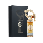 A luxurious bottle of Sehr Lattafa perfume by Lattafa, positioned beside its elegant black box. The tall, ribbed glass bottle transitions from clear at the base to a golden amber hue at the top. The centerpiece is an ornate, sculpted gold cap resembling an Arabian dagger or sword hilt, adorned with intricate detailing and a gemstone-like accent. The circular gold label on the front displays the name 'Sehr Lattafa' in Arabic and English.