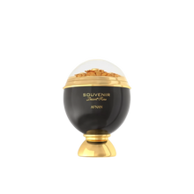 A luxurious and artistic perfume bottle of "Souvenir Desert Rose" by Afnan.