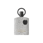 A grey, speckled fragrance bottle from Afnan’s Supremacy Collector’s Edition, featuring a circular black cap handle and an embossed black emblem on the front, displayed against a white background.