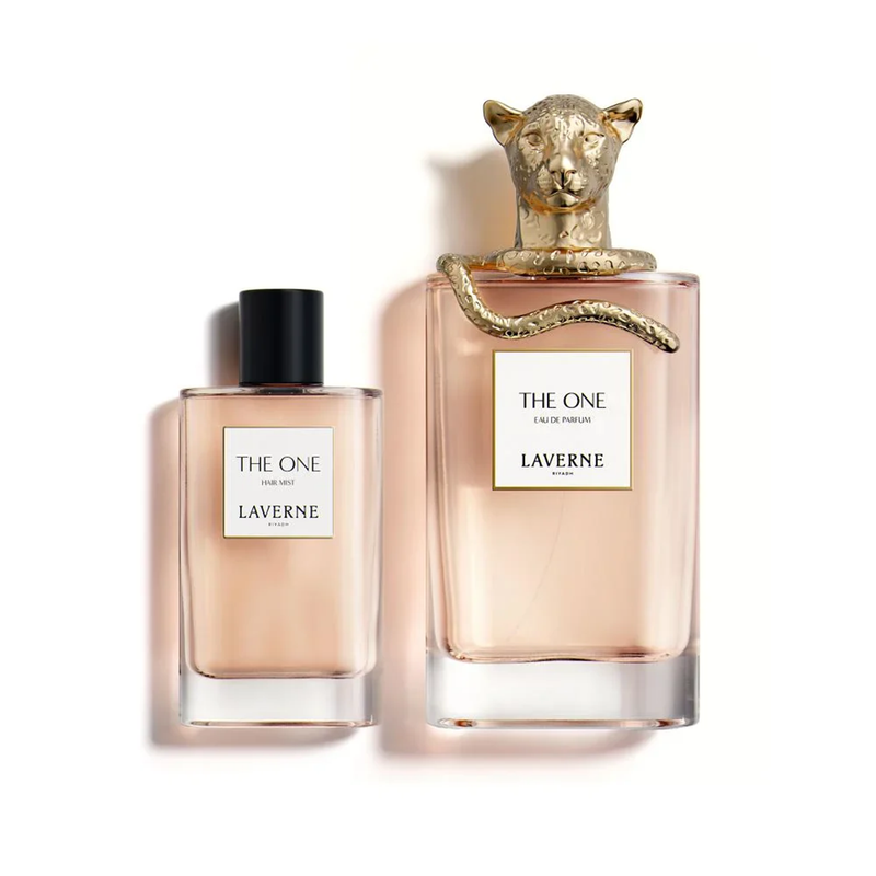 Laverne The One Eau De Parfum and hair mist bottles in soft peach glass with a gold panther cap.