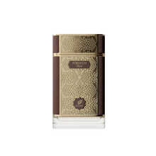 The image shows a sophisticated and elegant bottle of "Tobacco Oud" perfume by Afnan. The perfume bottle has a rectangular shape with a broad base and a short neck. It features a rich, dark brown color with golden geometric patterns that add a touch of intricate detail and luxury. The central part of the bottle has a gold label with the word "TOBACCO" prominently displayed in capital letters, followed by "Oud" in smaller font. 