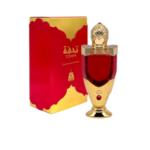 The image shows a luxurious perfume bottle next to its packaging. The bottle has a rich red color with a golden cap, detailed with intricate patterns.