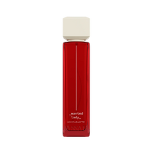 Assaf Wanted Lady Extrait De Parfum in a sleek translucent red glass bottle with an ivory square cap.