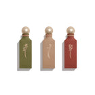 Three perfume bottles with gold caps and 'Ibrac' branding on a white background
